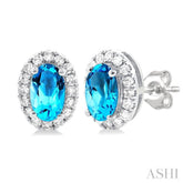 5x3 MM Oval Shape Blue Topaz and 1/8 Ctw Single Cut Diamond Halo Semi-Precious Stud Earrings in 14K White Gold