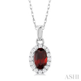 5x3 MM Oval Shape Garnet and 1/20 Ctw Round Cut Diamond Halo Semi-Precious Pendant with Chain in 10K White Gold