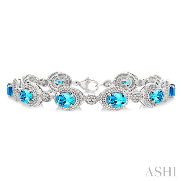 7X5 MM Oval Shape Blue Topaz and 1/10 Ctw Round Cut Diamond Semi-Precious Bracelet in Sterling Silver