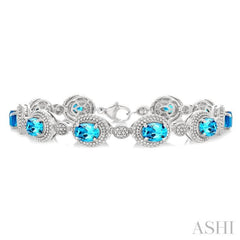 7X5 MM Oval Shape Blue Topaz and 1/10 Ctw Round Cut Diamond Semi-Precious Bracelet in Sterling Silver