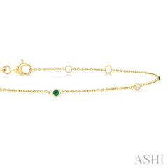 1.75 MM Emerald and 1/20 Ctw Round Cut Diamond Precious Station Bracelet in 14K Yellow Gold