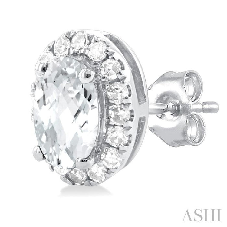 5x3 MM Oval Shape White Topaz and 1/8 Ctw Single Cut Diamond Halo Semi-Precious Stud Earrings in 14K White Gold