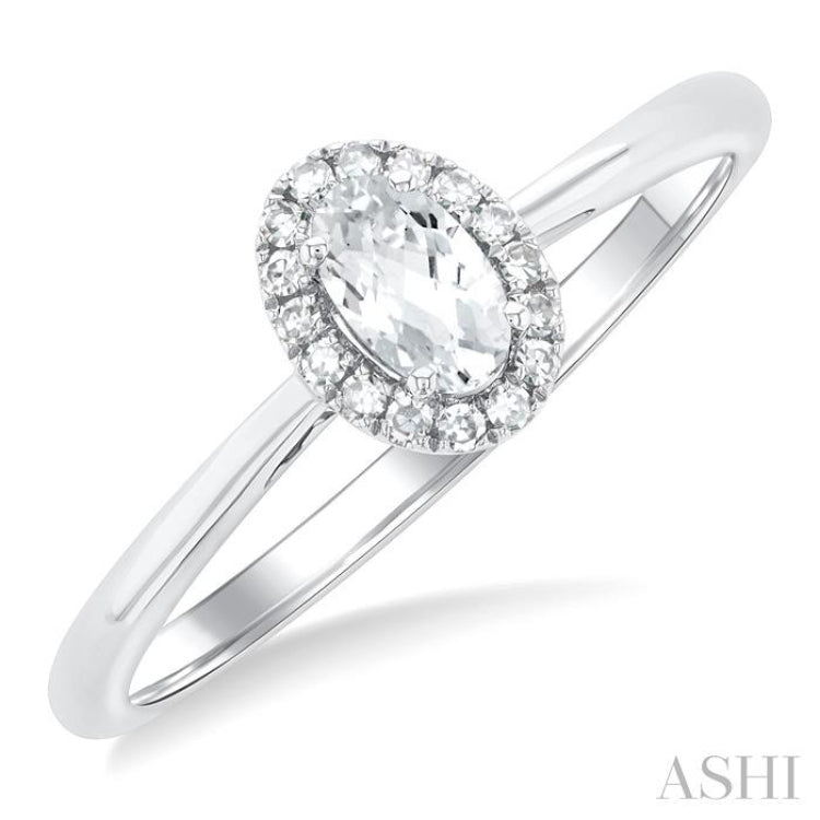 5x3 MM Oval Shape White Topaz and 1/20 Ctw Round Cut Diamond Halo Semi-Precious Ring in 10K White Gold