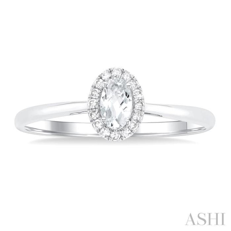5x3 MM Oval Shape White Topaz and 1/20 Ctw Round Cut Diamond Halo Semi-Precious Ring in 10K White Gold
