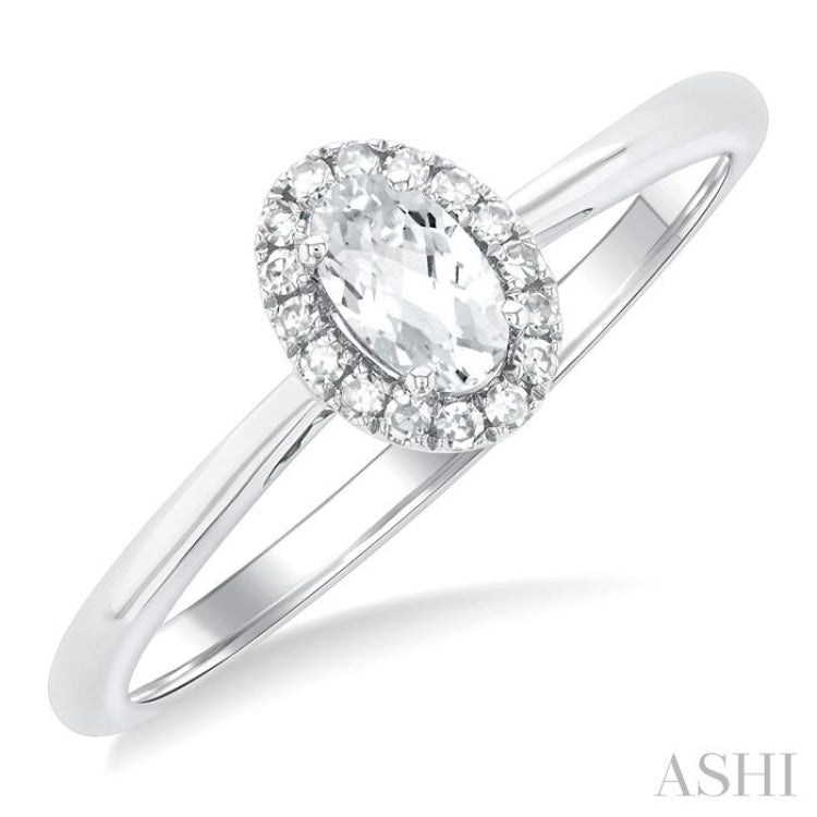 5x3 MM Oval Shape White Topaz and 1/20 Ctw Round Cut Diamond Halo Semi-Precious Ring in 14K White Gold
