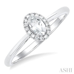 5x3 MM Oval Shape White Topaz and 1/20 Ctw Round Cut Diamond Halo Semi-Precious Ring in 14K White Gold