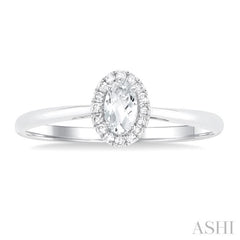 5x3 MM Oval Shape White Topaz and 1/20 Ctw Round Cut Diamond Halo Semi-Precious Ring in 14K White Gold