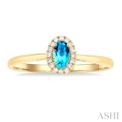 5x3 MM Oval Shape Blue Topaz and 1/20 Ctw Round Cut Diamond Halo Semi-Precious Ring in 14K Yellow Gold