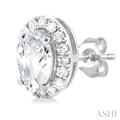 5x3 MM Oval Shape White Topaz and 1/8 Ctw Round Cut Diamond Halo Semi-Precious Stud Earrings in 10K White Gold