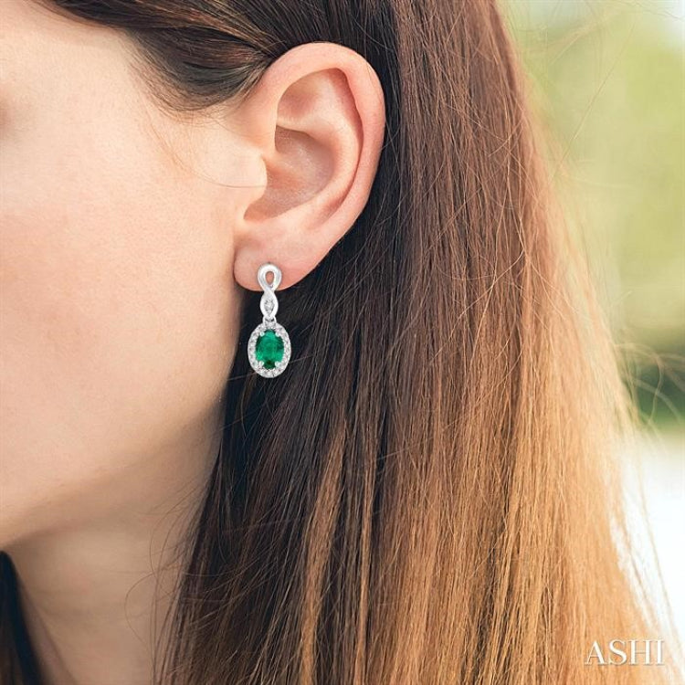 5x3 MM Oval Cut Emerald and 1/6 Ctw Round Cut Diamond Earrings in 14K White Gold