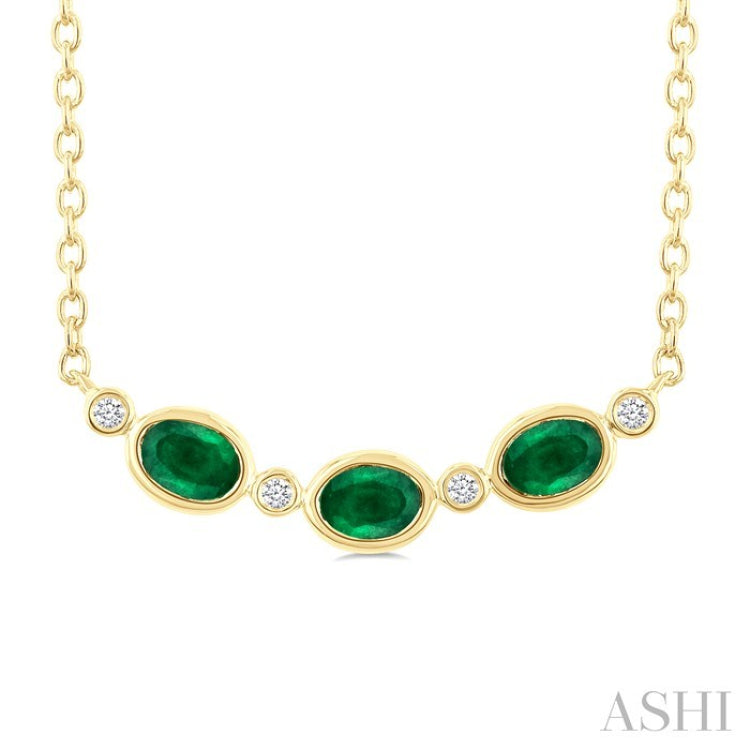 4X3 MM Oval Cut Emerald and 1/50 Ctw Bezel Set Round Cut Diamond Precious Fashion Necklace in 10K Yellow Gold