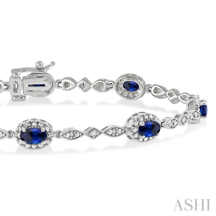 5x3 MM Oval Cut Sapphire and 1/20 Ctw Single Cut Diamond Bracelet in 10K White Gold