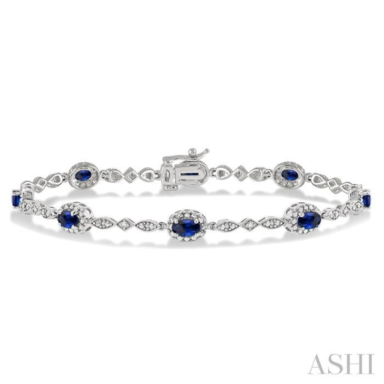 5x3 MM Oval Cut Sapphire and 1/20 Ctw Single Cut Diamond Bracelet in 14K White Gold