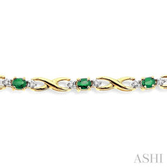 4x3 MM Oval Cut Emerald and 1/10 Ctw Single Cut Diamond Bracelet in 10K Yellow Gold