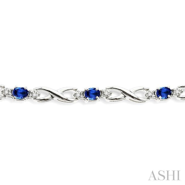 4x3 MM Oval Cut Sapphire and 1/10 Ctw Single Cut Diamond Bracelet in 10K White Gold