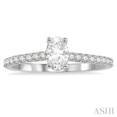 1/2 Ctw Round Cut Diamond Engagement Ring With 1/4 ct Oval Cut Center Stone in 14K White Gold