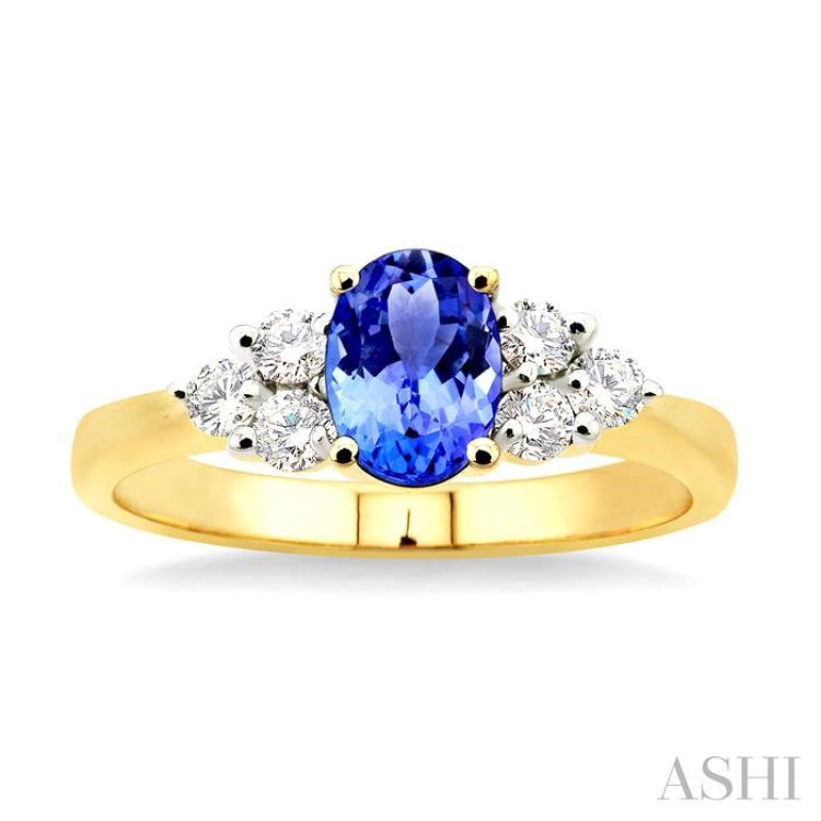 7x5mm Oval Cut Tanzanite and 1/3 Ctw Round Cut Diamond Ring in 14K Yellow Gold