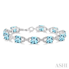 7x7  MM Cushion Shape Blue Topaz and 1/20 Ctw Round Cut Diamond Fashion Bracelet in Sterling Silver