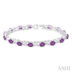 7x5  MM Oval Cut Amethyst and 1/20 Ctw Round Cut Diamond Fashion Bracelet in Sterling Silver