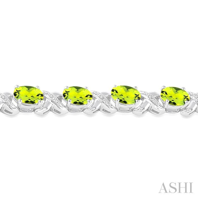 7x5  MM Oval Cut Peridot and 1/20 Ctw Round Cut Diamond Fashion Bracelet in Sterling Silver