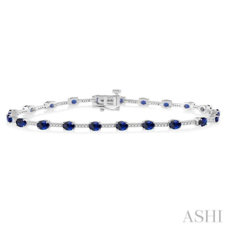 1/3 Ctw Round Cut Diamond & 4x3 MM Oval Cut Sapphire Precious Bracelet in 10K White Gold