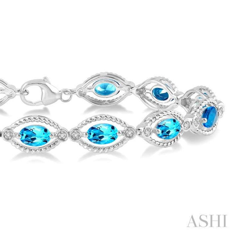 1/10 Ctw Round Cut Diamond & 6x4 MM Oval Cut Blue Topaz Semi Precious Bracelet in Sterling Silver