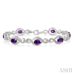 1/10 Ctw Round Cut Diamond & 7x5 MM Oval Cut Amethyst Semi Precious Bracelet in Sterling Silver