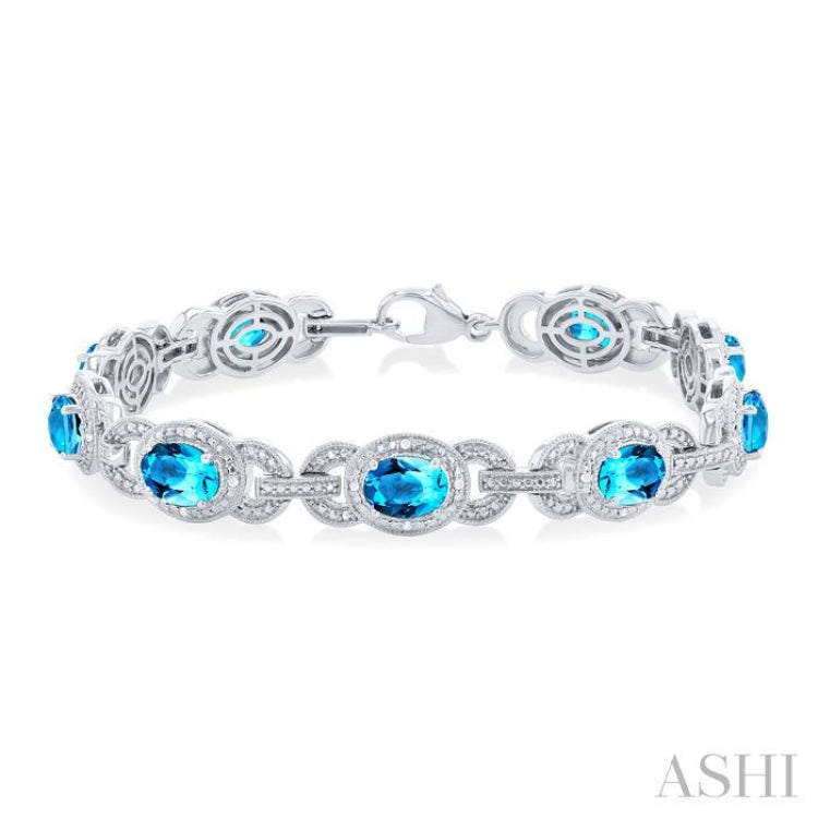 1/10 ctw Oval Shape 7x5 MM Blue Topaz and Round Cut Diamond Semi Precious Bracelet in Sterling Silver