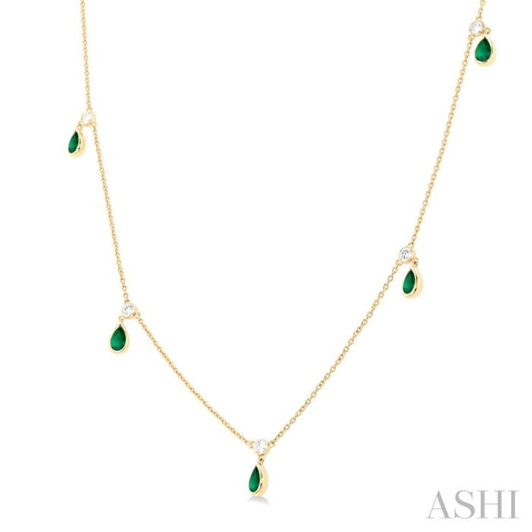 1/8 ctw Round Cut Diamonds and 5X3MM Pear Shape Emerald Precious Station Necklace in 10K Yellow Gold