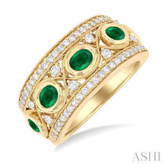 4X3MM Oval and 2.8MM Round Cut Emerald and 3/8 ctw Curvy Crisscross Single Cut Diamond Precious Band in 14K Yellow Gold