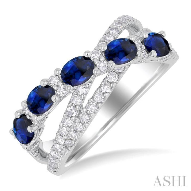 4X3MM Oval Cut Sapphire and 1/2 ctw Single Cut Diamond Split Crisscross Precious Band in 14K White Gold