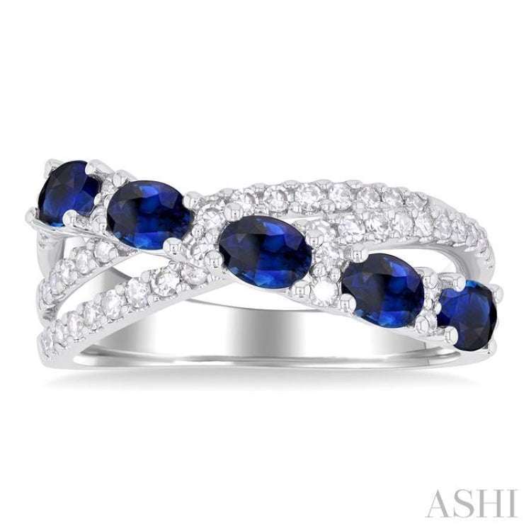 4X3MM Oval Cut Sapphire and 1/2 ctw Single Cut Diamond Split Crisscross Precious Band in 14K White Gold