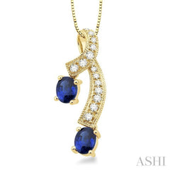 5x4MM Oval Cut Sapphire and 1/6 Ctw Round Cut Diamond Precious Pendant in 14K Yellow Gold with Chain