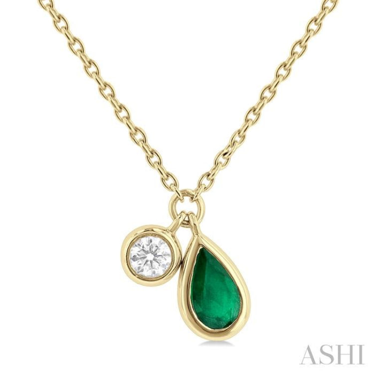 1/50 ctw Pear Cut 5X3MM Emerald and Bezel Set Round Cut Diamond Precious Necklace in 10K Yellow Gold