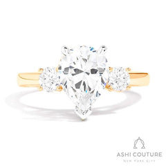 Bridal 3-Stone Pear Semi-Mount Engagement Ring With Round Side Diamonds in Yellow and White Gold